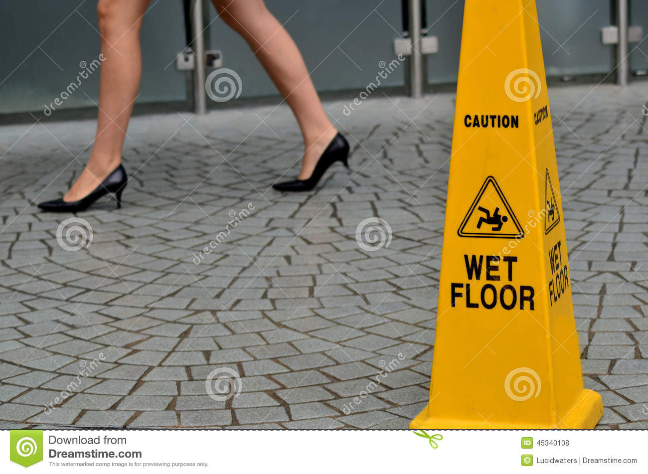 Slippery Floor Surface Warning Sign And Symbol In Building Hall