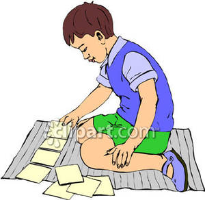 Boy Playing A Card Game   Royalty Free Clipart Picture