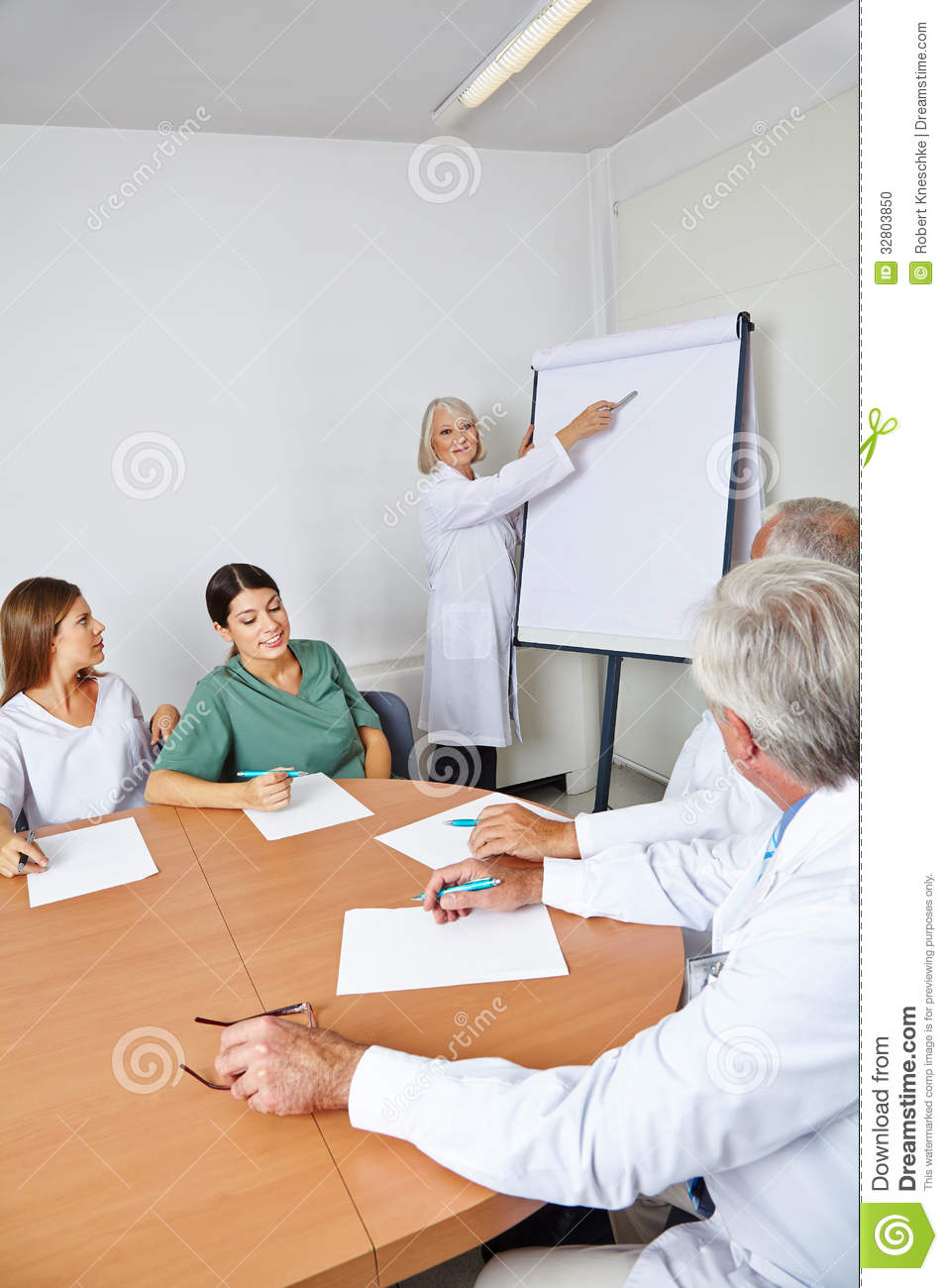 Doctor Giving Lecture At Team Meeting Stock Photo   Image  32803850