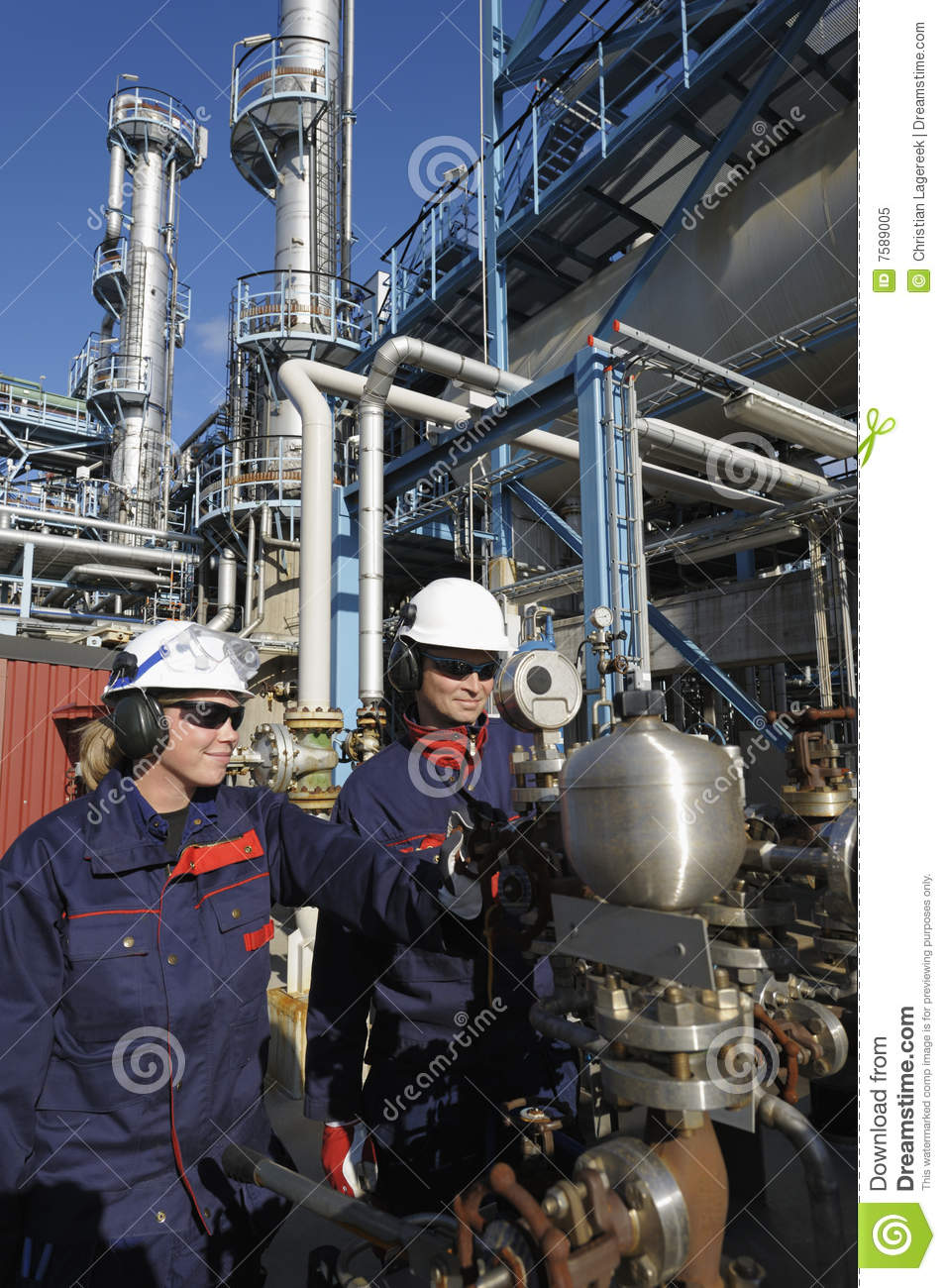 Engineers One Female Talking In Phone In Front Of Large Pipeline    