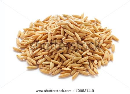 Pile Of Unmilled Rice Grains Isolated On White   Stock Photo