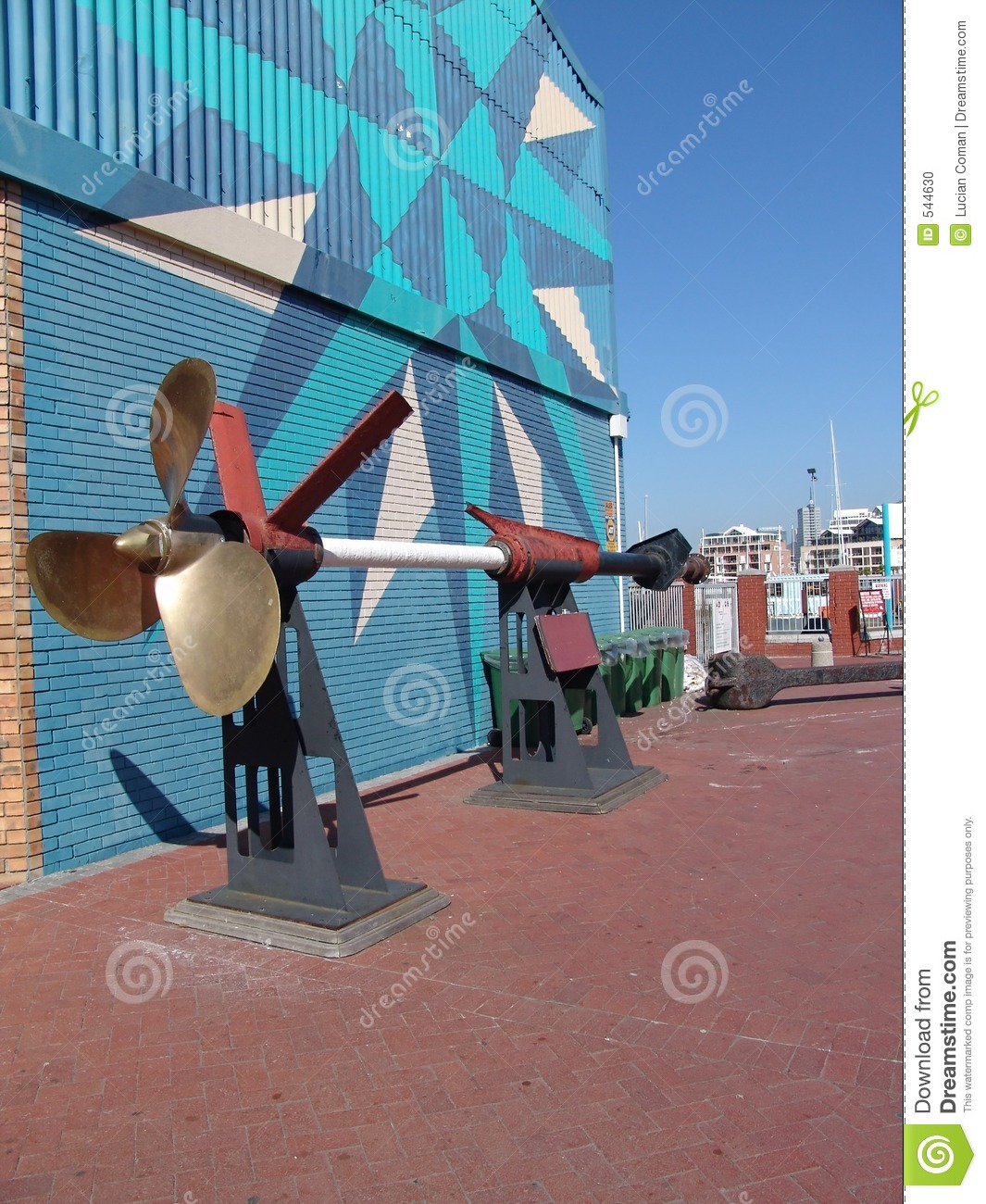 Ship S Propeller And Long Shaft On Static Display Beside A Colorful