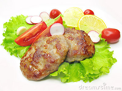 Cooked Meat Cutlets With Tomato Lemon And Radish On Lettuce Salad