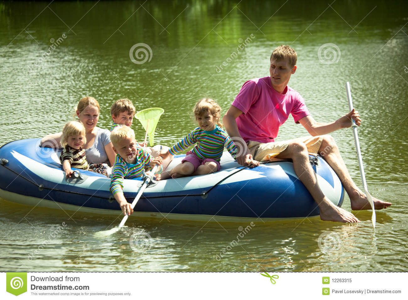 Family Float On An Inflatable Boat And Fish Net  Royalty Free Stock
