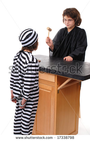     In Front Of Her Sister Who Is Handcuffed In A Striped Jail Uniform