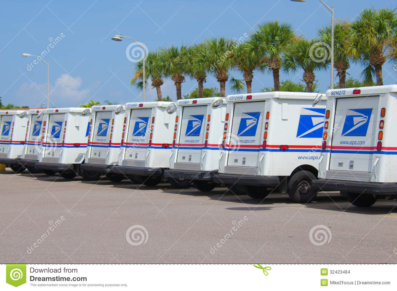 Long Row Of United States Postal Service Trucks In A Long Row On A