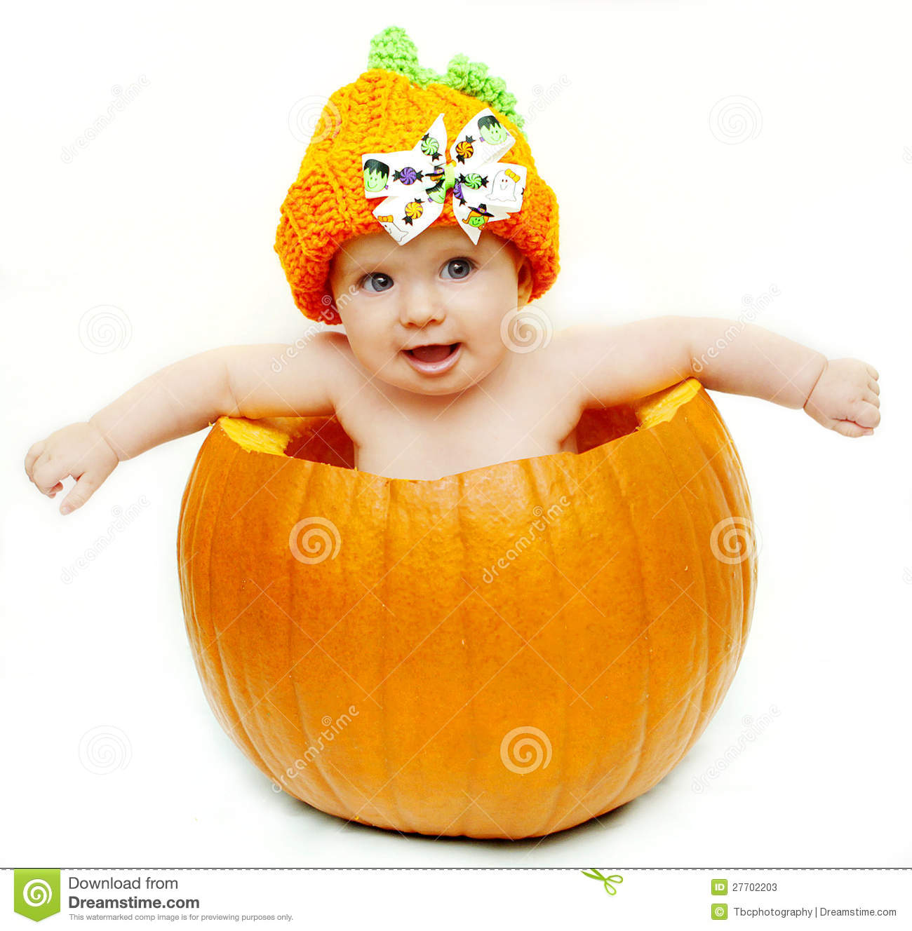 Cute Baby Girl With A Pumpkin Hat Sitting In A Pumpkin 