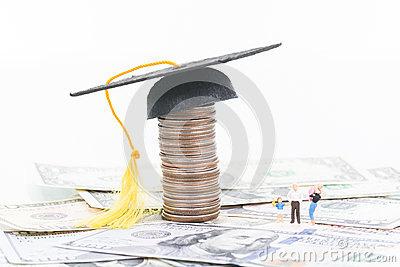 Besides The Mortarboard On Top Of A Stacked Of Coins Close Up