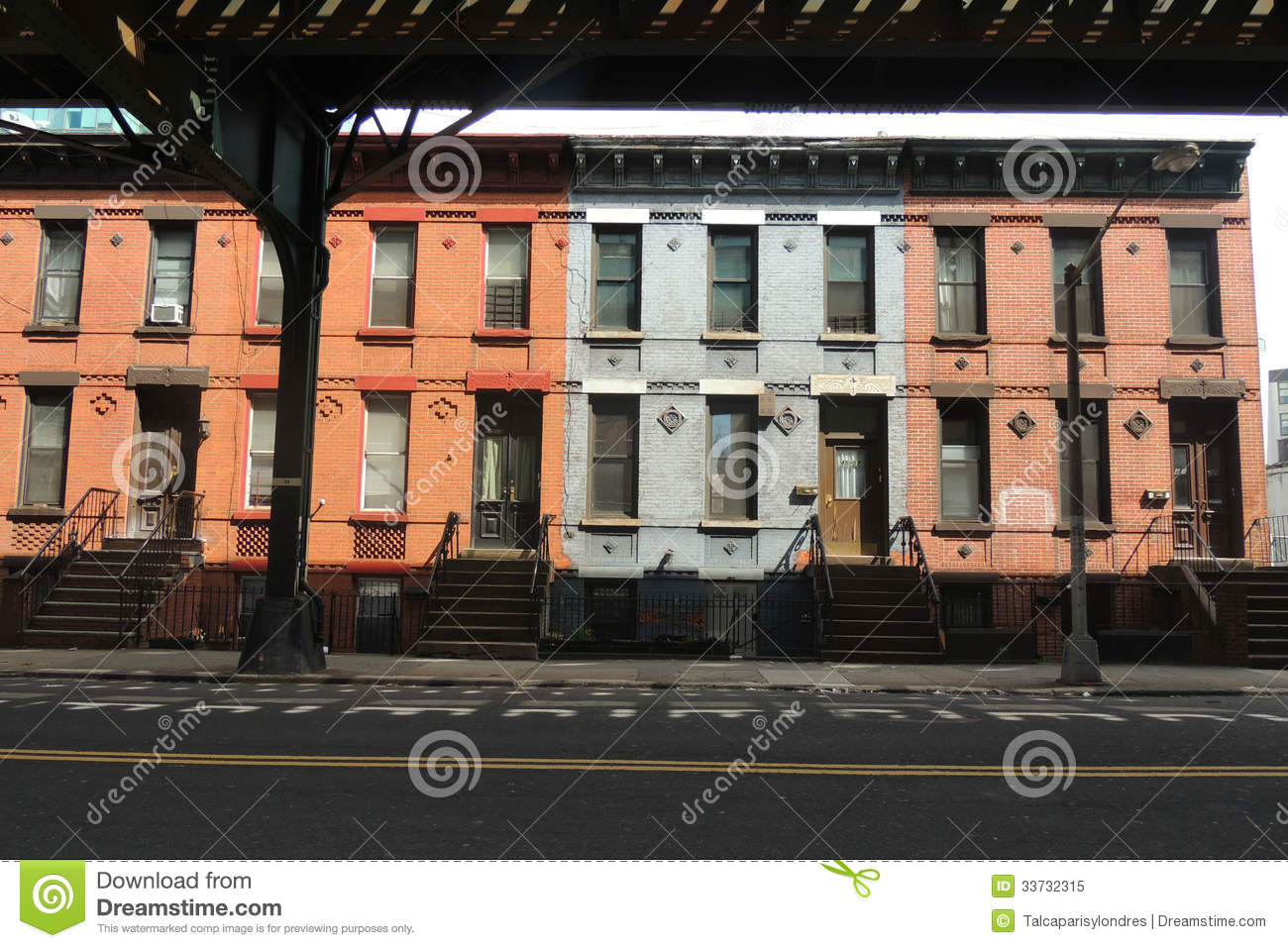 Colorful Row Houses In Queens New York Under The Subway Tracks