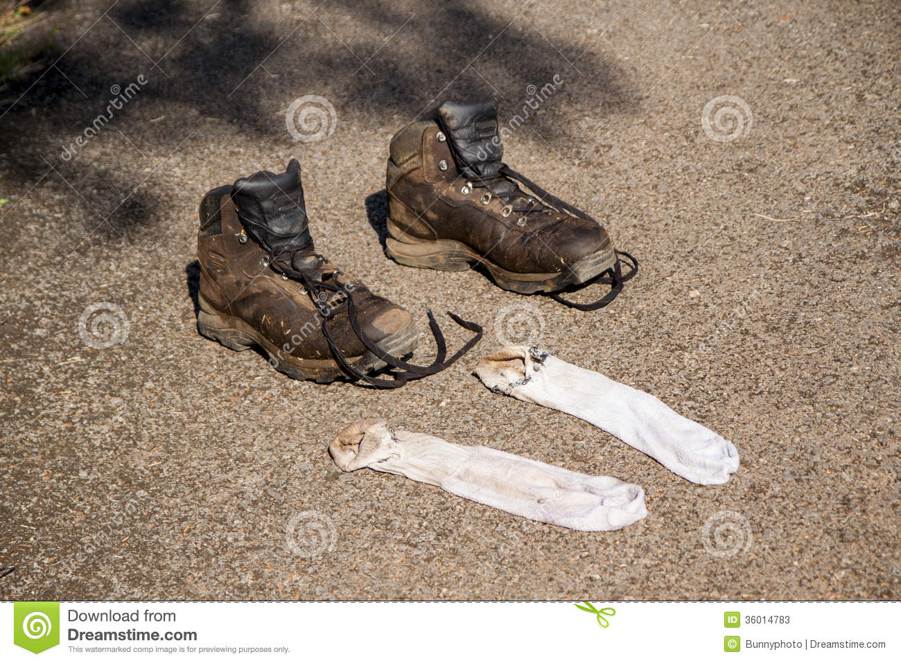 Dirty Boots And Socks Laid On The Ground