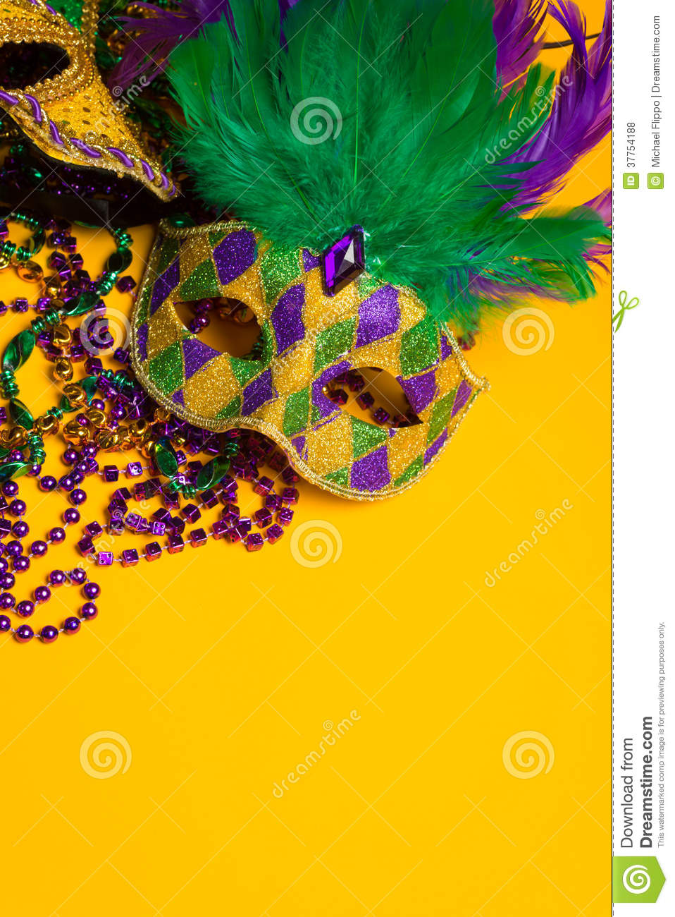 Festive Colorful Group Of Mardi Gras Or Carnivale Masks On A Yellow    