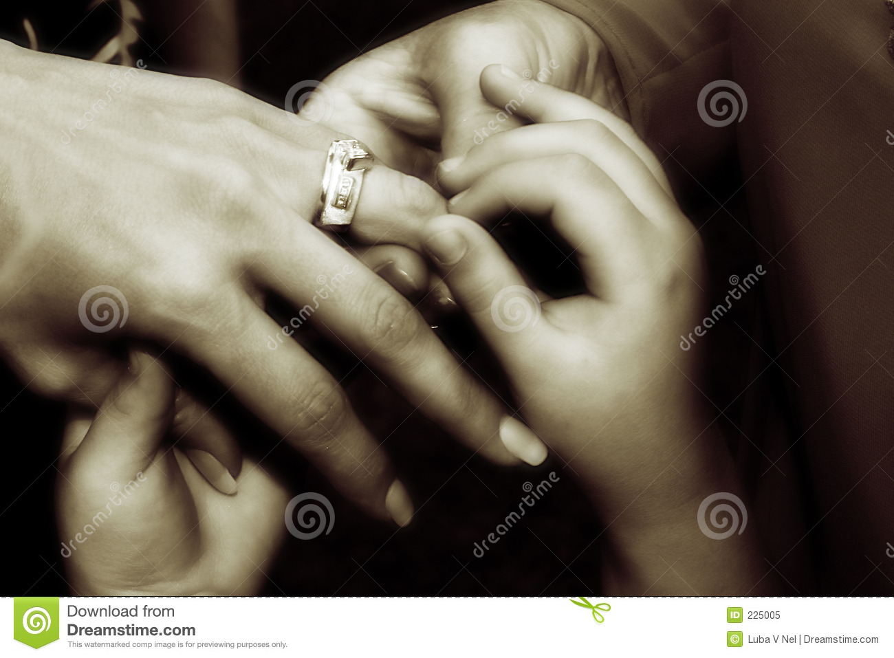 Hands Of Three Generations Of Women Looking At A Weding Ring   Soft