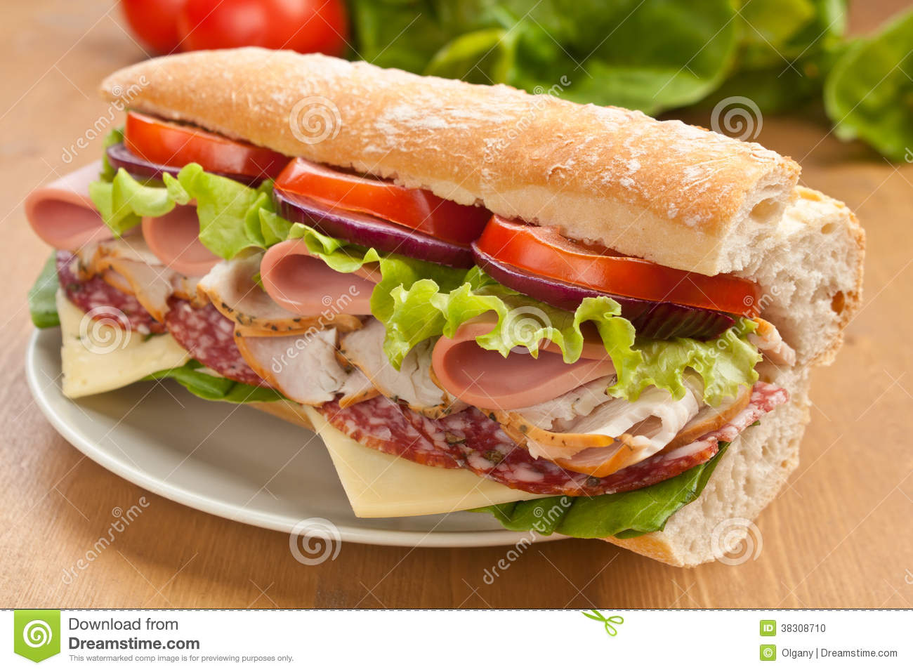 Baguette Sandwich With Lettuce Tomatoes Ham Turkey Breast Salami