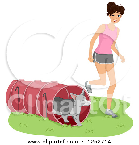 Caucasian Woman Running Her Dog Through An Agility Course Tunnel By