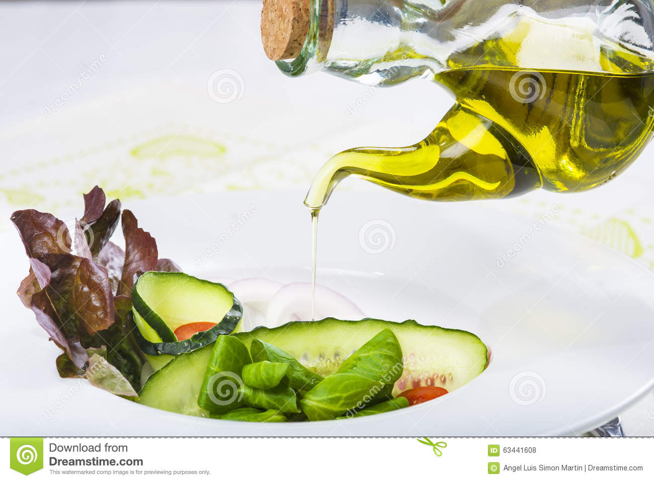 Olive Oil On A Mediterranean Or Garden Fresh Salad In A Restaurant