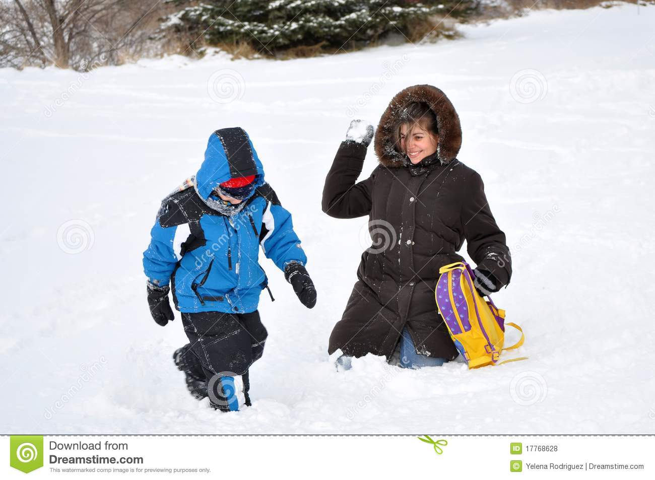 Hispanic Family Playing In The Snow On A Cold Wint Royalty Free Stock    