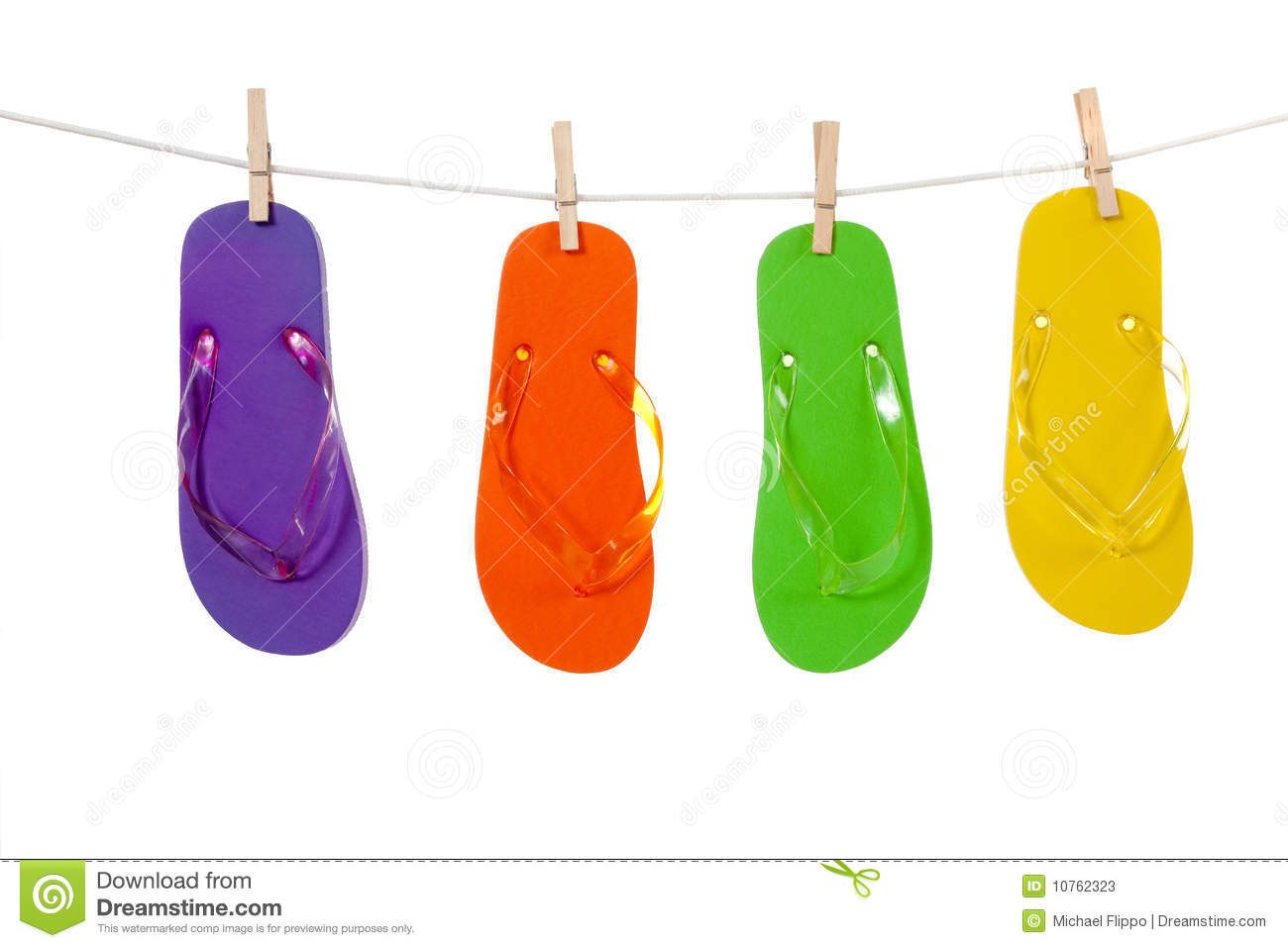 Group Of Colorful Flip Flop Sandles Hanging By Clips From A Clothes