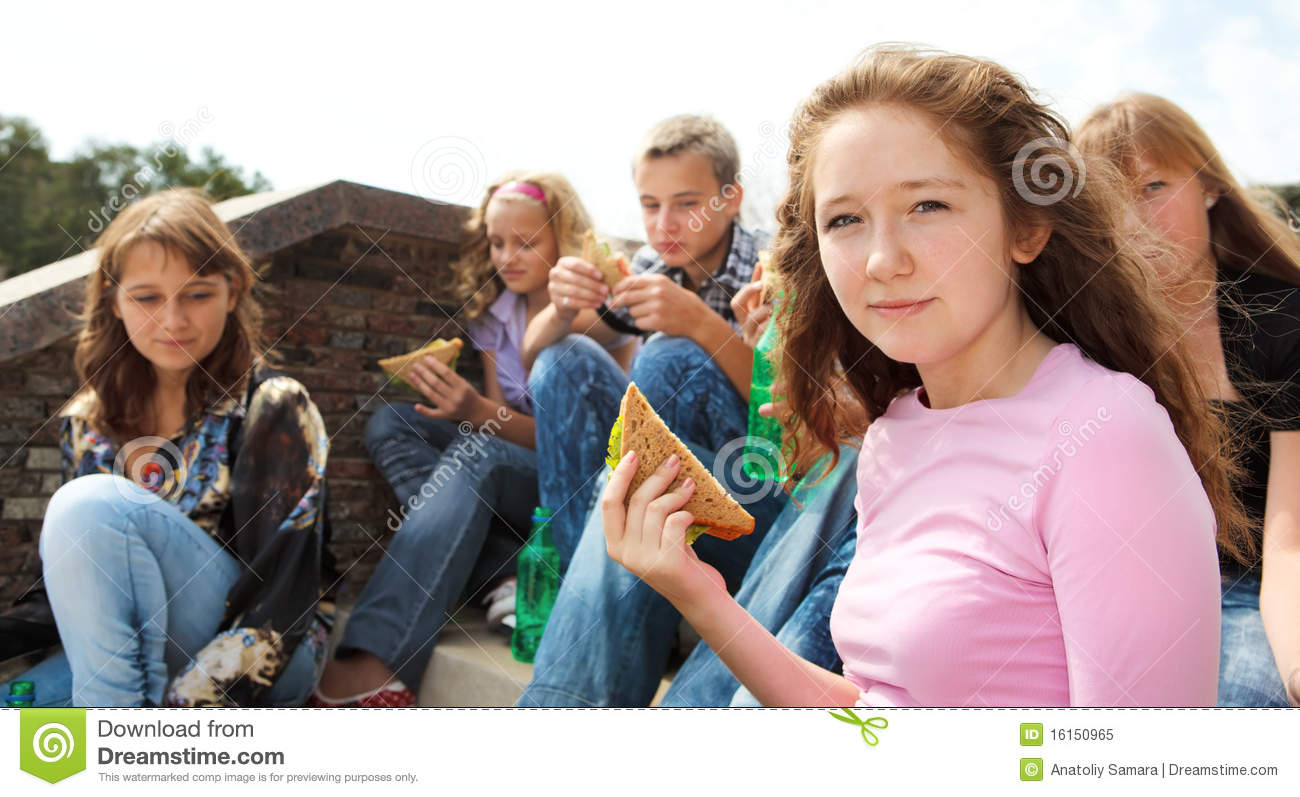 Teens Eating Take Away Food 
