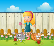 Girl Playing With Her Cats Inside The Fence Stock Images