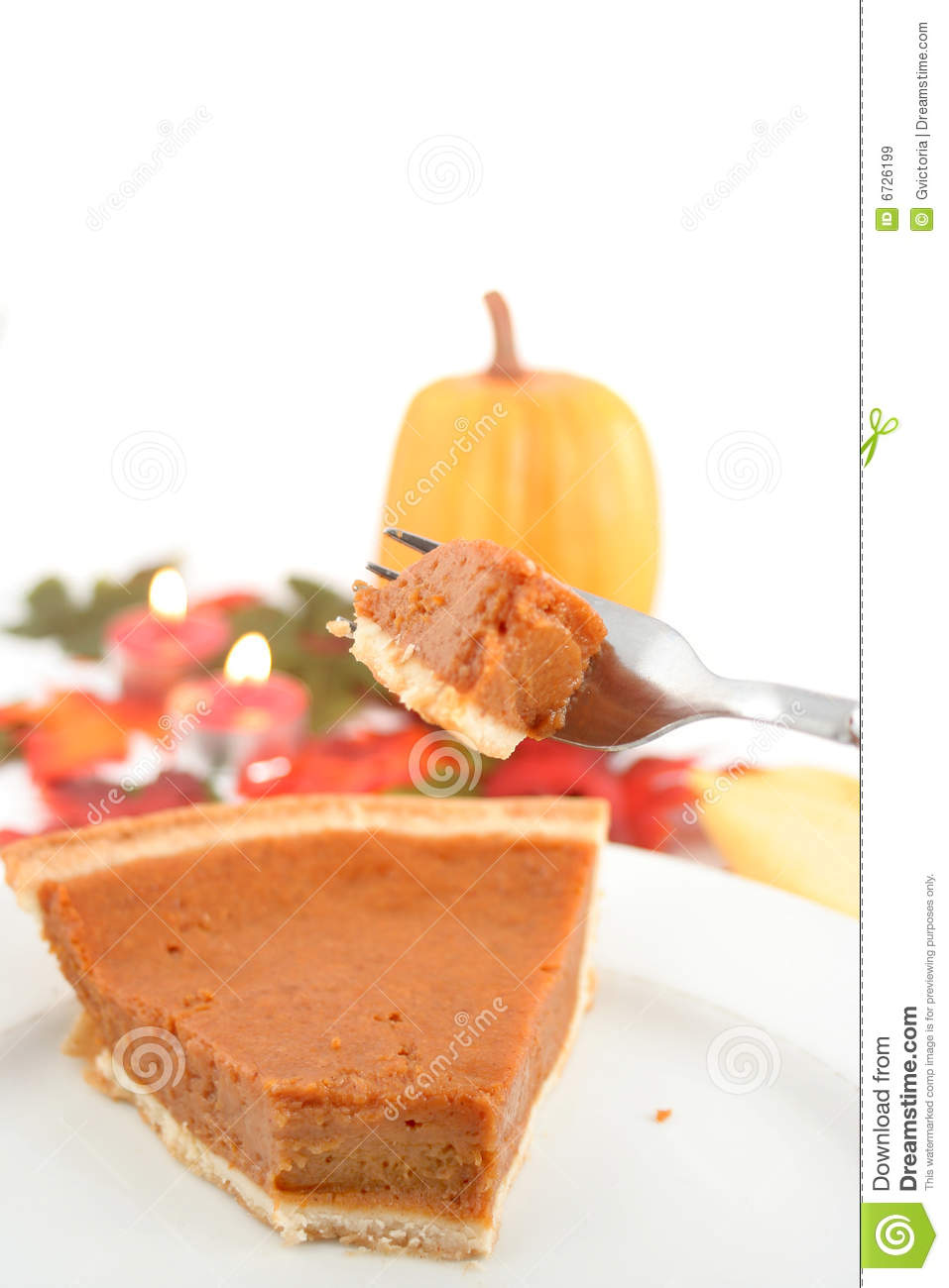 One Piece Of Pumpkin Pie On White Plate Surrounded By Fall Leaves  The