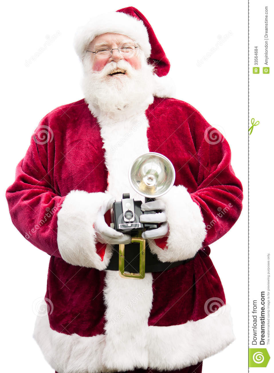 Santa Claus Holding A Vintage Camera Laughs Looking Into The Camera    