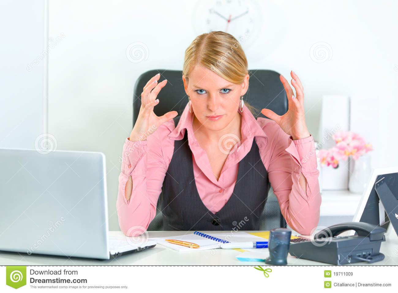 Angry Business Woman Sitting At Office Desk Royalty Free Stock Images    