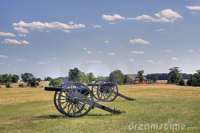 Two Civil War Era Cannons In Open Field Royalty Free Stock Photos