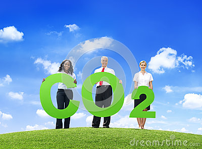 Stock Photo  Business People Holding Word Carbon Dioxide Outdoors