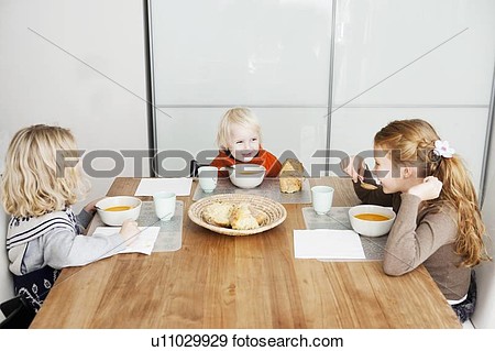 Stock Photograph   Children Eating Lunch At Table  Fotosearch   Search    