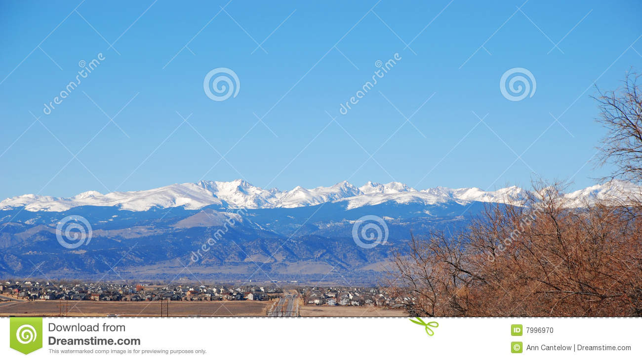 The Rocky Mountains In Colorado Rise Above The Eastern Prairie