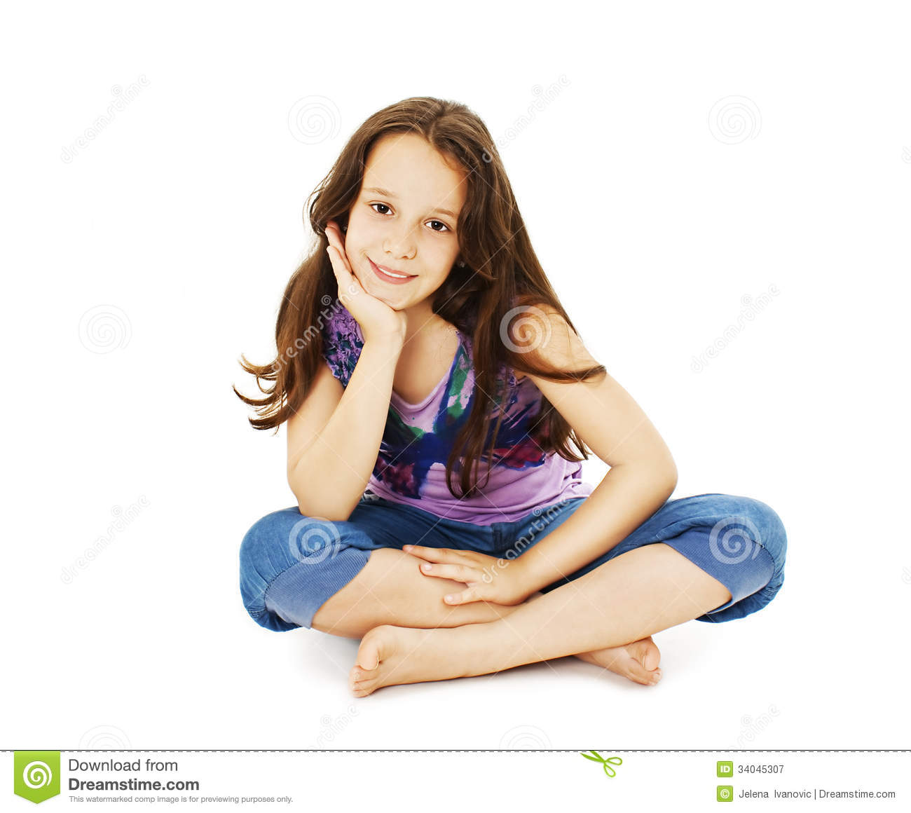 Pretty Little Girl Sitting On The Floor In Jeans Royalty Free Stock