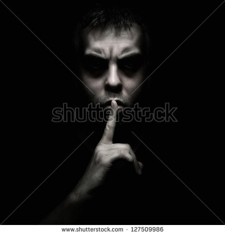 Evil Man Gesturing Silence Quiet Isolated On Black Background   Stock
