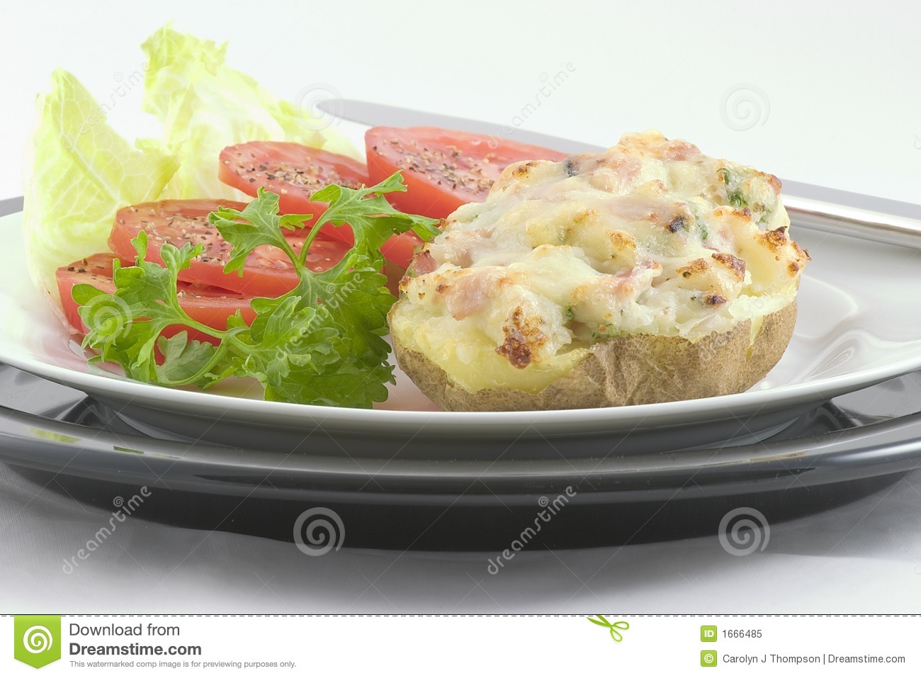 Light Lunch Or Dinner Consisting Of A Baked Potato Stuffed With Ham    