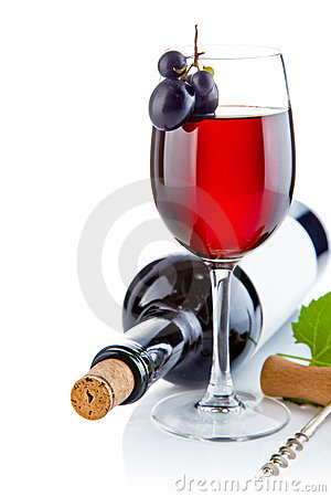 Red Wine In Glass With Grapes On White Background
