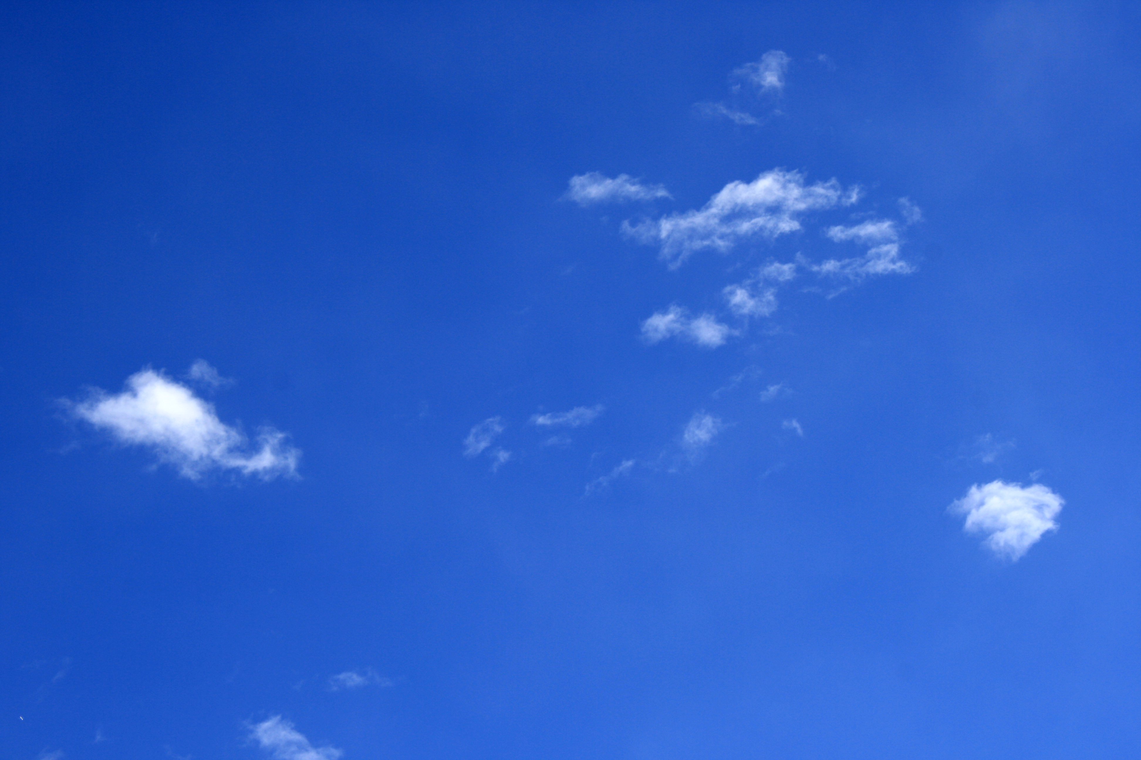 Bright Blue Sky With A Few Tiny White Clouds Picture   Free Photograph