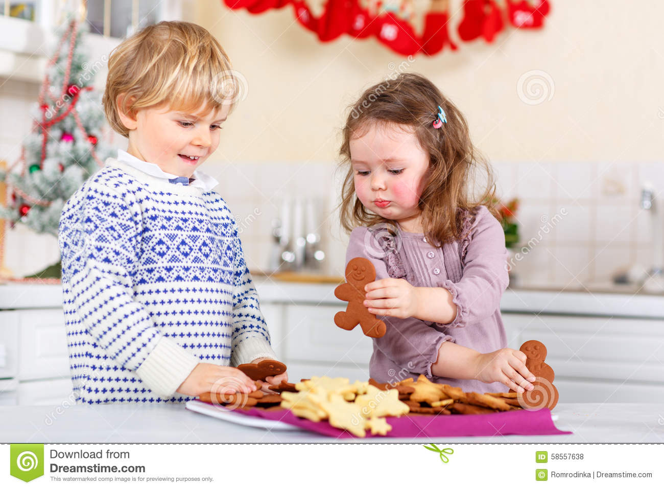 Stock Photo  Little Boy And Girl Siblings Baking Gingerbread Cookies    
