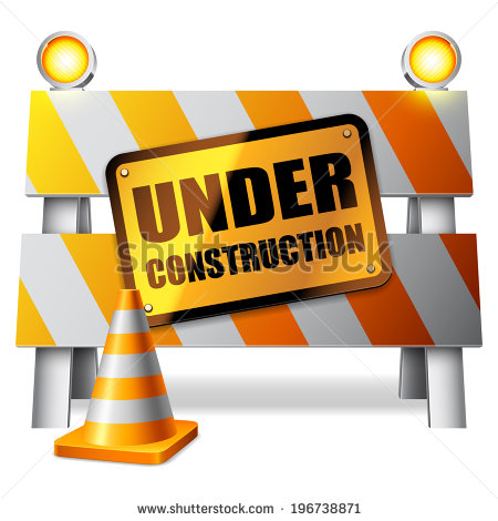 Under Construction Barrier Warning Sign And Traffic Cone    Stock