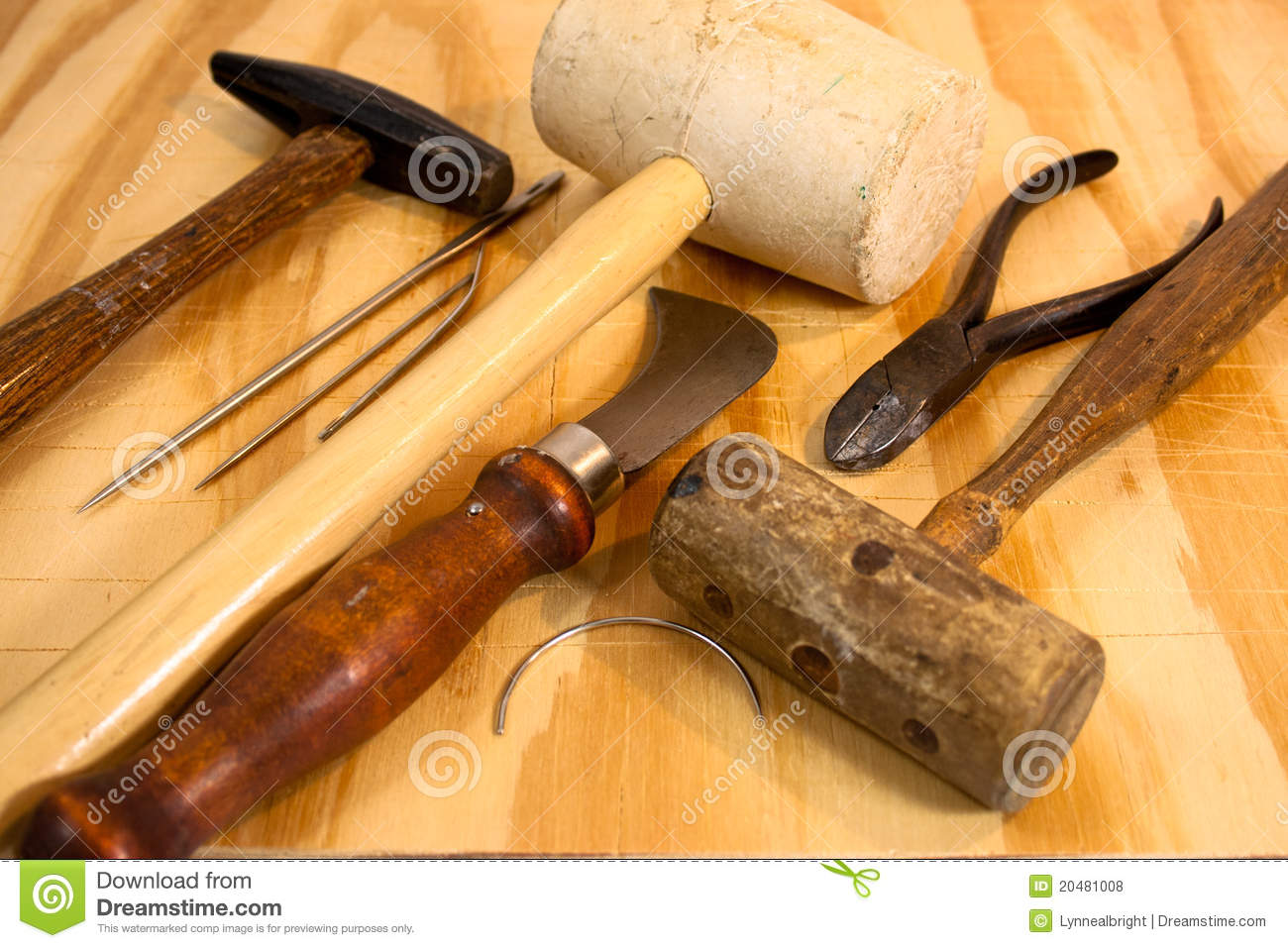 An Assortment Of Old Hand Tools Used In Upholstery Including Hammers