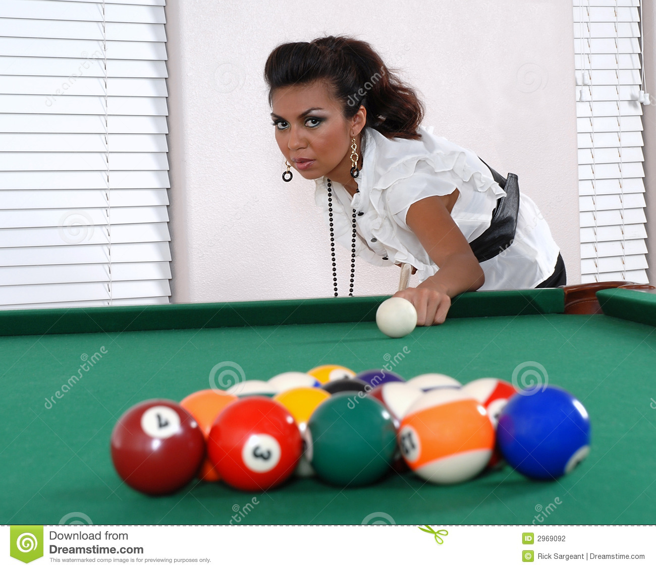 Female Pool Player Getting Ready To Break With Her First Shot   