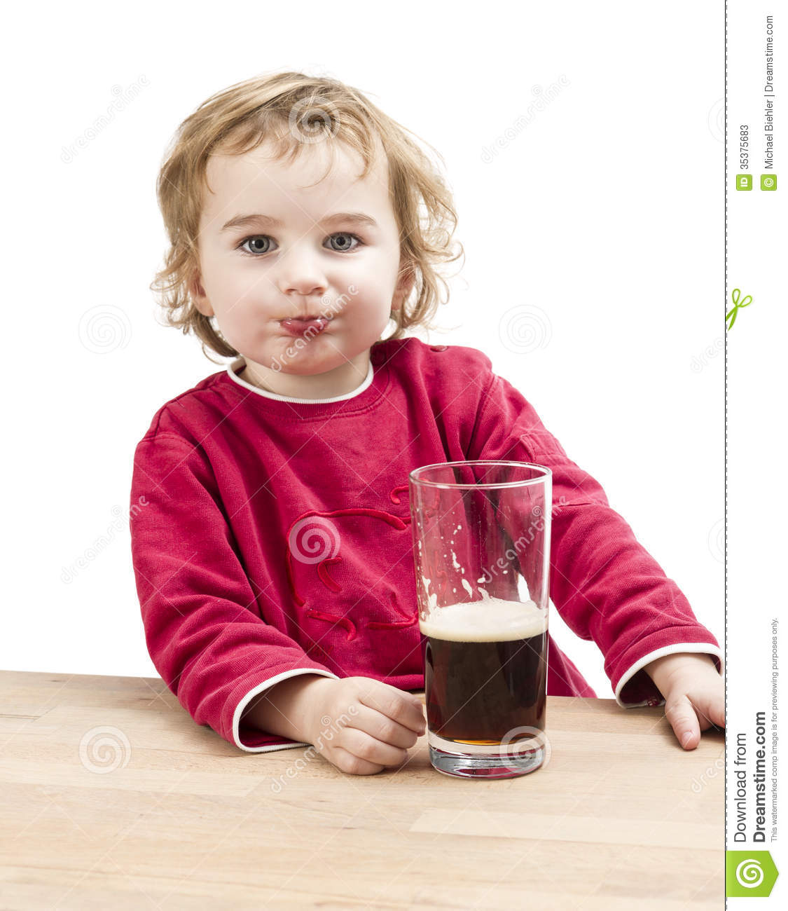 Young Girl Drinking Beer In Light Background  Studio Shot 