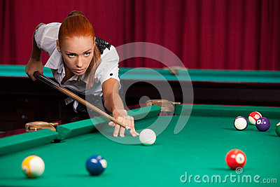Confident Young Red Hair Woman Playing Pool 