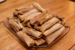 Several Bunch Of Fresh Steamed Tamales With Husks Stock Images