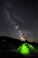 Milky Way On Night Sky And Glowing Green Tent By Sergiy Trofimov