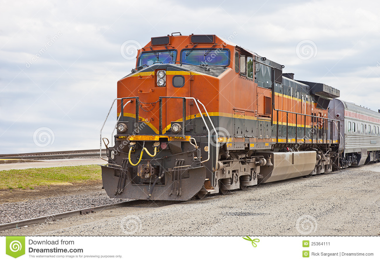 Modern Freight Train On Railway Track With Sky And Cloudscape    