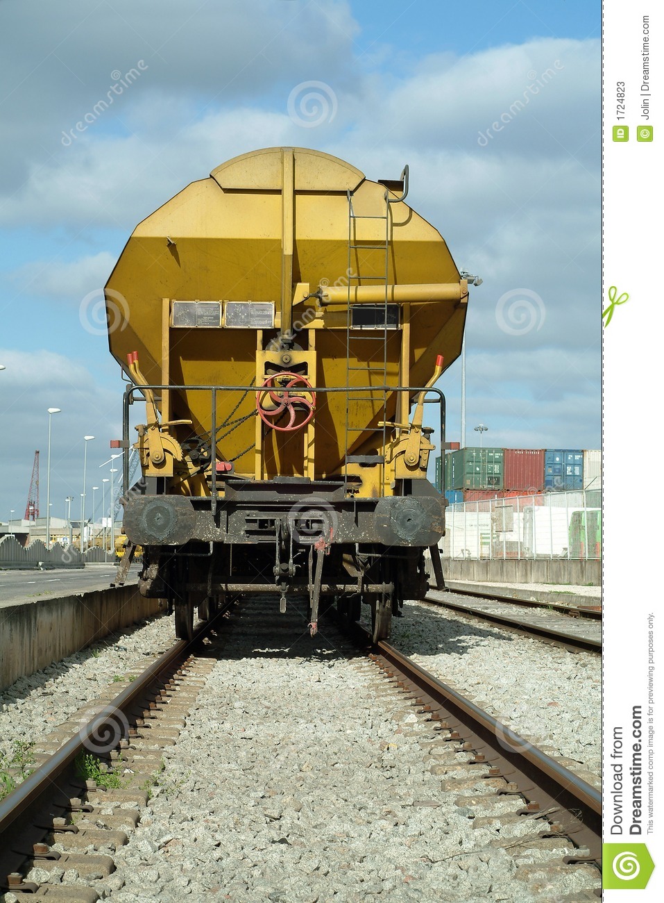 Yellow Freight Train Cargo Wagon In The Train Station 