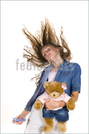 Picture Of Young Pre Teen Girl Dancing With Teddy Bear And Mp3 Player