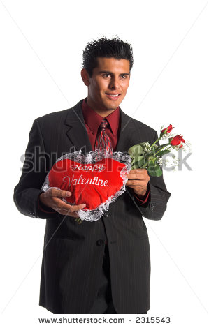 Handsome Young Hispanic Business Man In A Suit Presenting Red Roses