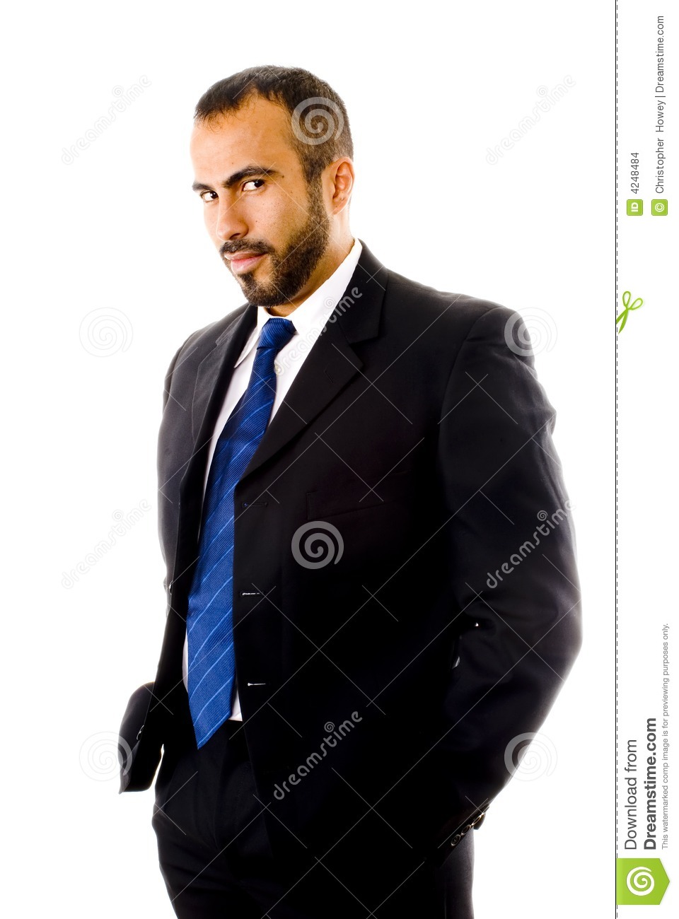 This Image Shows A Hispanic Man In A Suit With A Coy Look