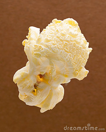 Popcorn Isolated Against A Brown Background Isolation Is On A