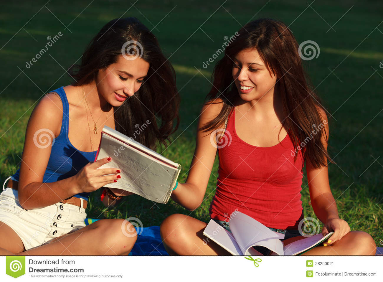 Beautiful Multicultural Young College Women Studying Outdoors On